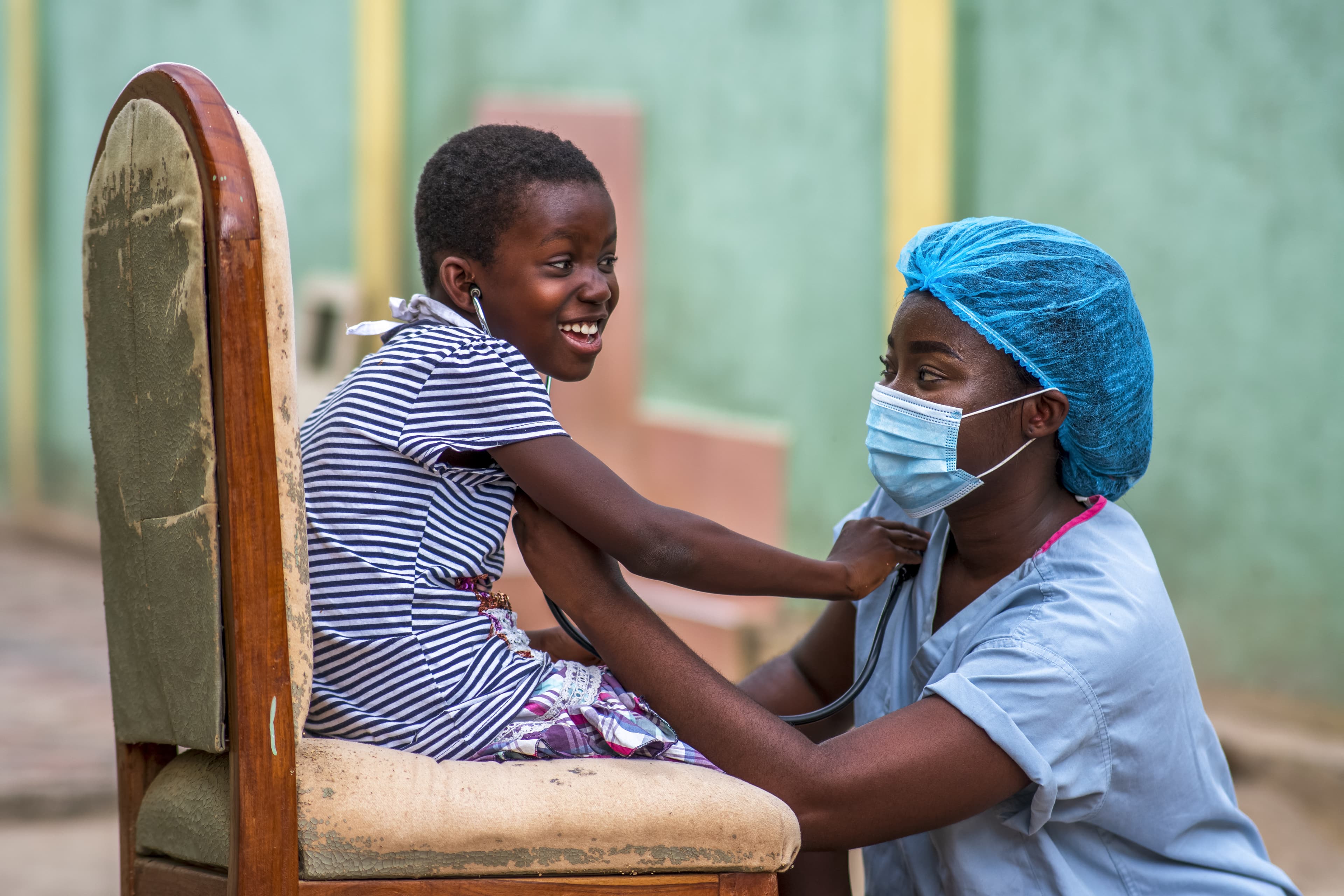 Healthcare worker checking a patient's vitals